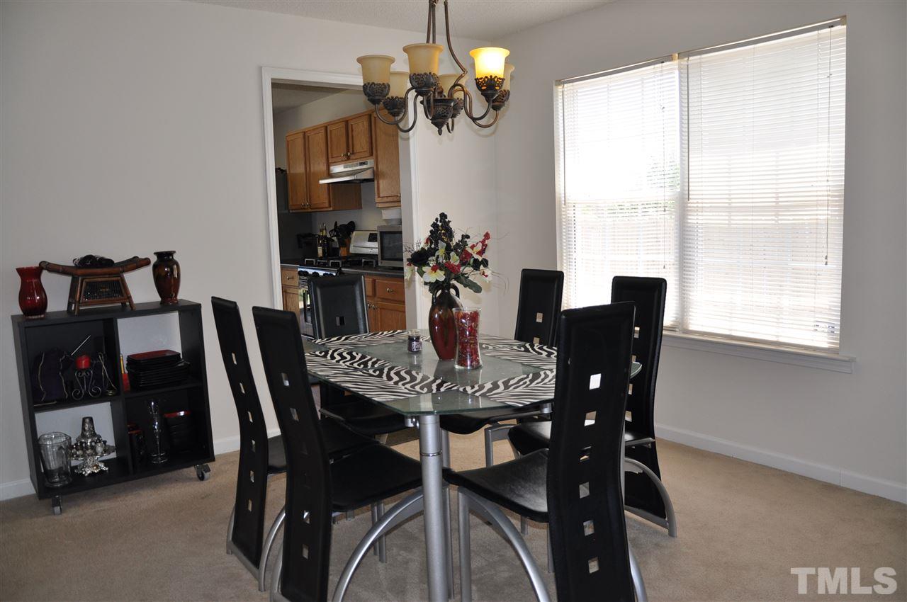 3305 Marcony Way Raleigh, NC 27610 - Photo 7 of 25 a view of a dining room with furniture window and outside view