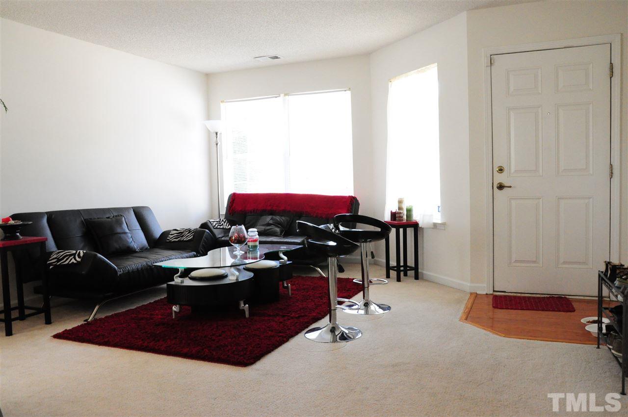 3305 Marcony Way Raleigh, NC 27610 - Photo 9 of 25 a living room with furniture a air conditioner and a window