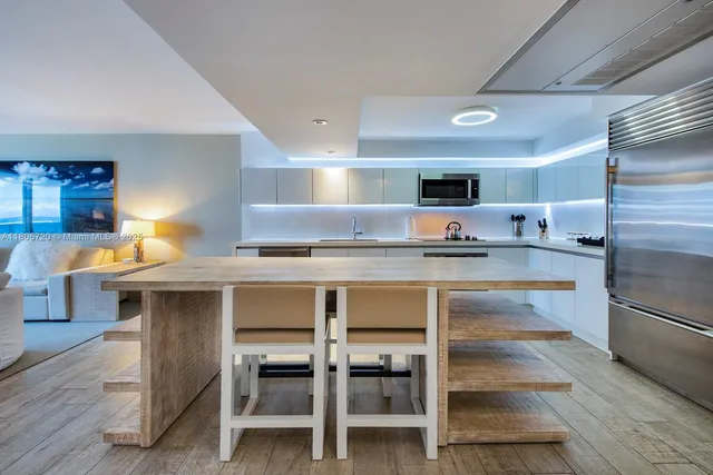 a kitchen with kitchen island cabinets and counter space