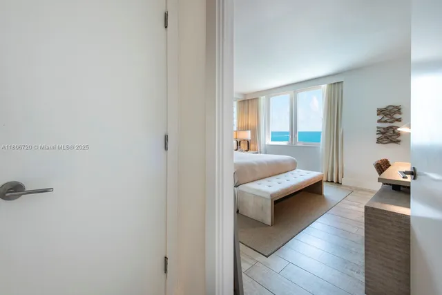 a bedroom with furniture and a window