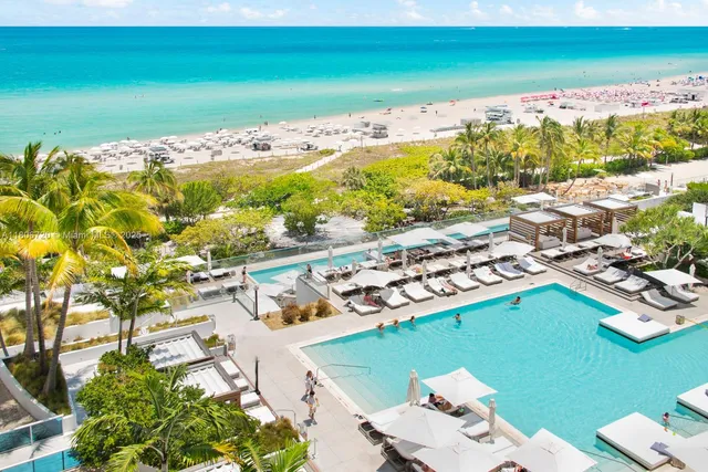 a view of a swimming pool and an ocean view