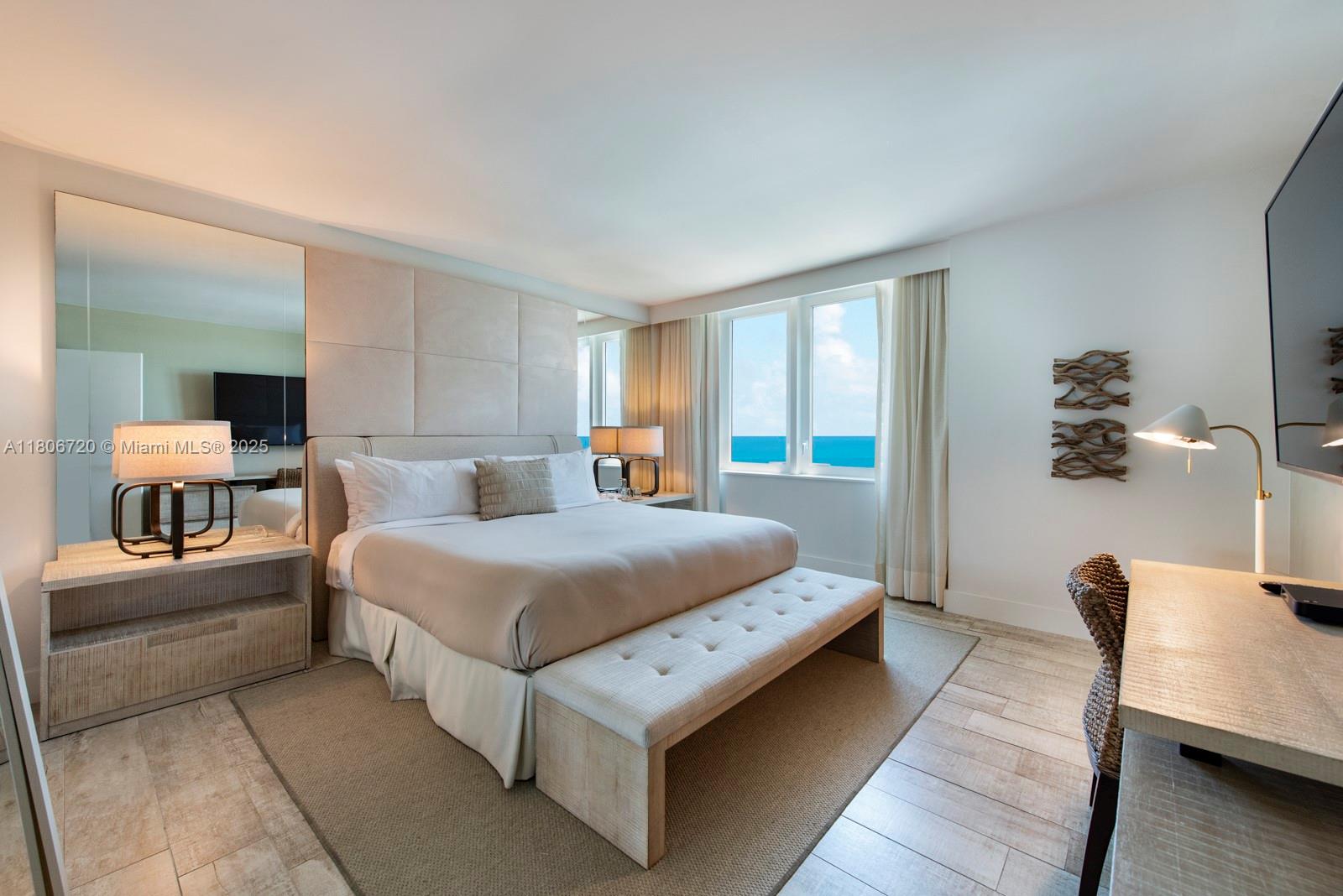 102 24th Street, Unit 1012 Miami Beach, FL 33139 - Photo 4 of 18 a bedroom with bed and window