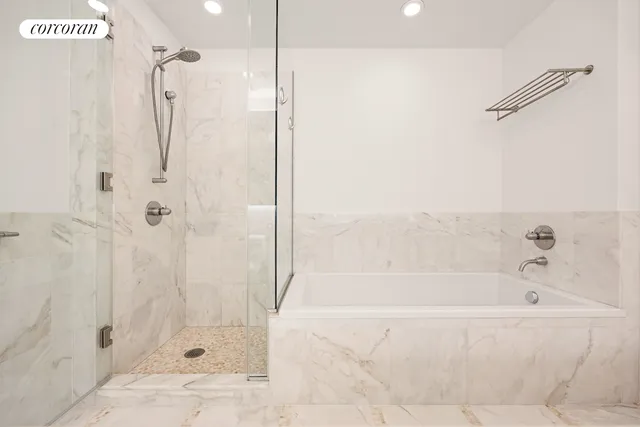 a bathroom with a granite countertop sink a toilet and a mirror