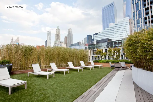 a living room with furniture a lamp and a large window