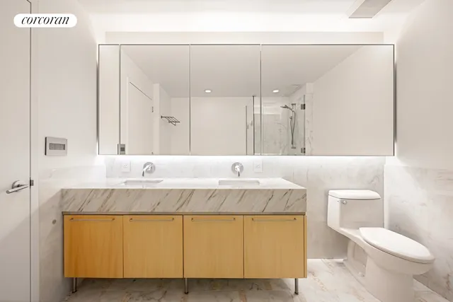 a bedroom with a large bed and a large window