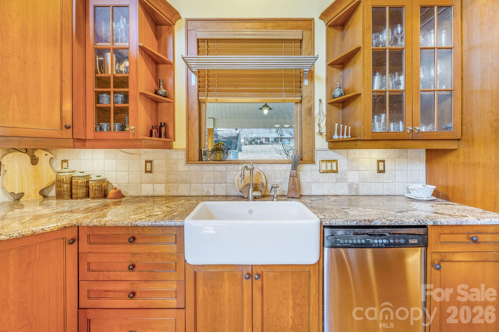 22 Mountain Spring Lane Canton, NC 28716 - Photo 15 of 48 a kitchen with granite countertop a sink and a window