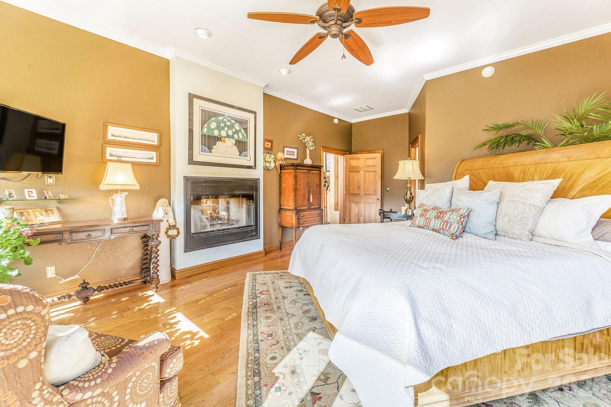 22 Mountain Spring Lane Canton, NC 28716 - Photo 20 of 48 a bed room with a bed and a television