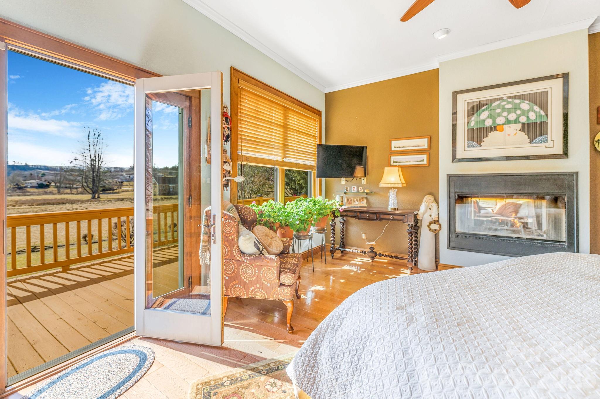22 Mountain Spring Lane Canton, NC 28716 - Photo 21 of 48 a bedroom with a bed and glass windows