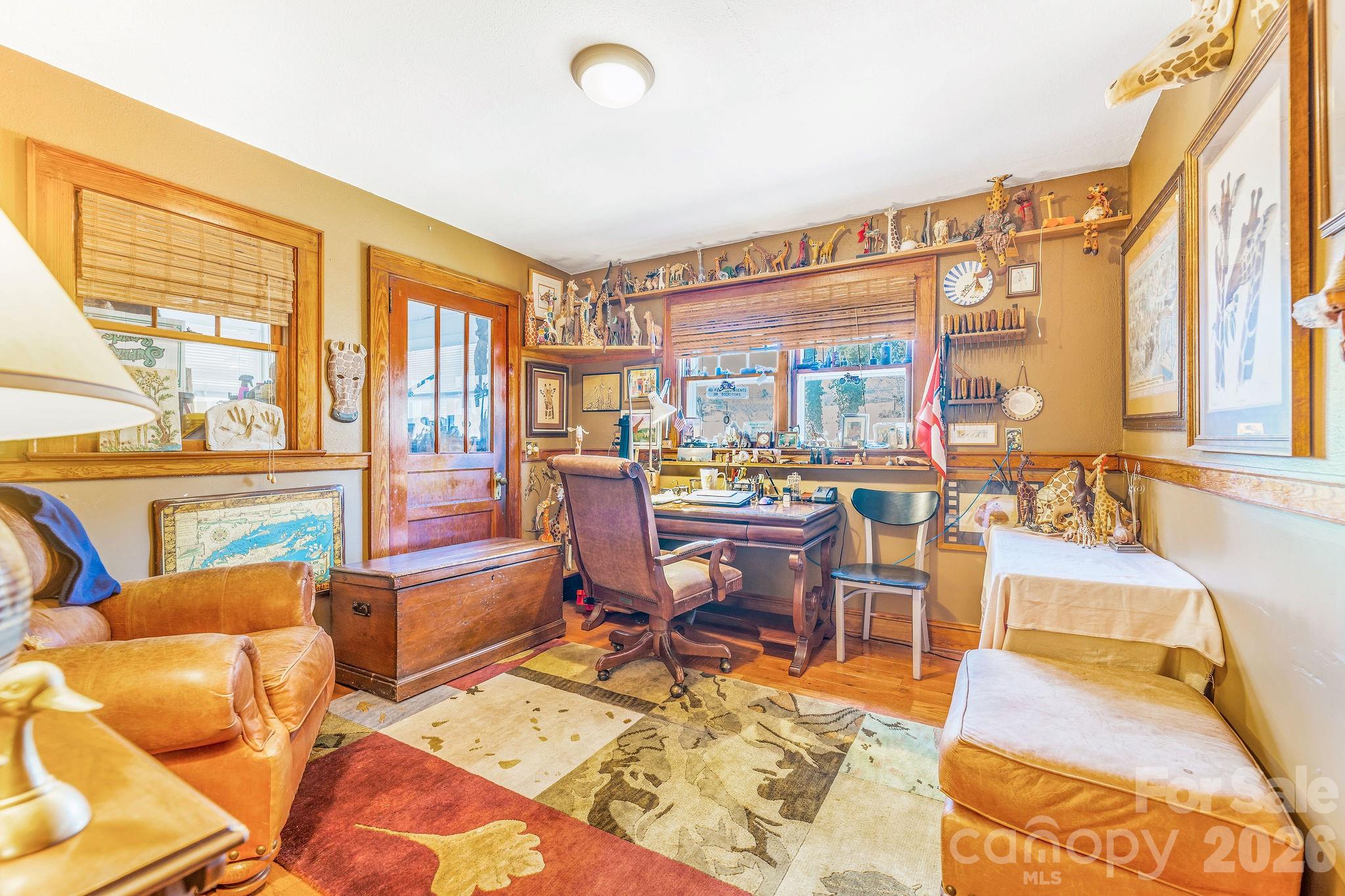 22 Mountain Spring Lane Canton, NC 28716 - Photo 30 of 48 a living room with furniture a rug and a floor to ceiling window