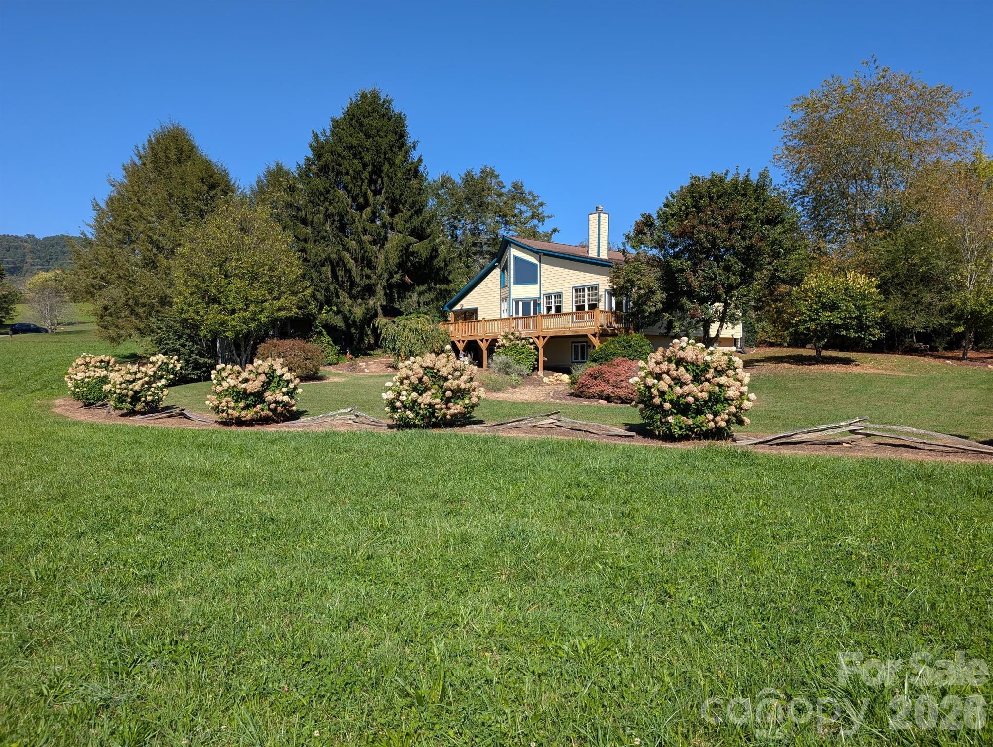22 Mountain Spring Lane Canton, NC 28716 - Photo 4 of 48 a front view of a house with garden