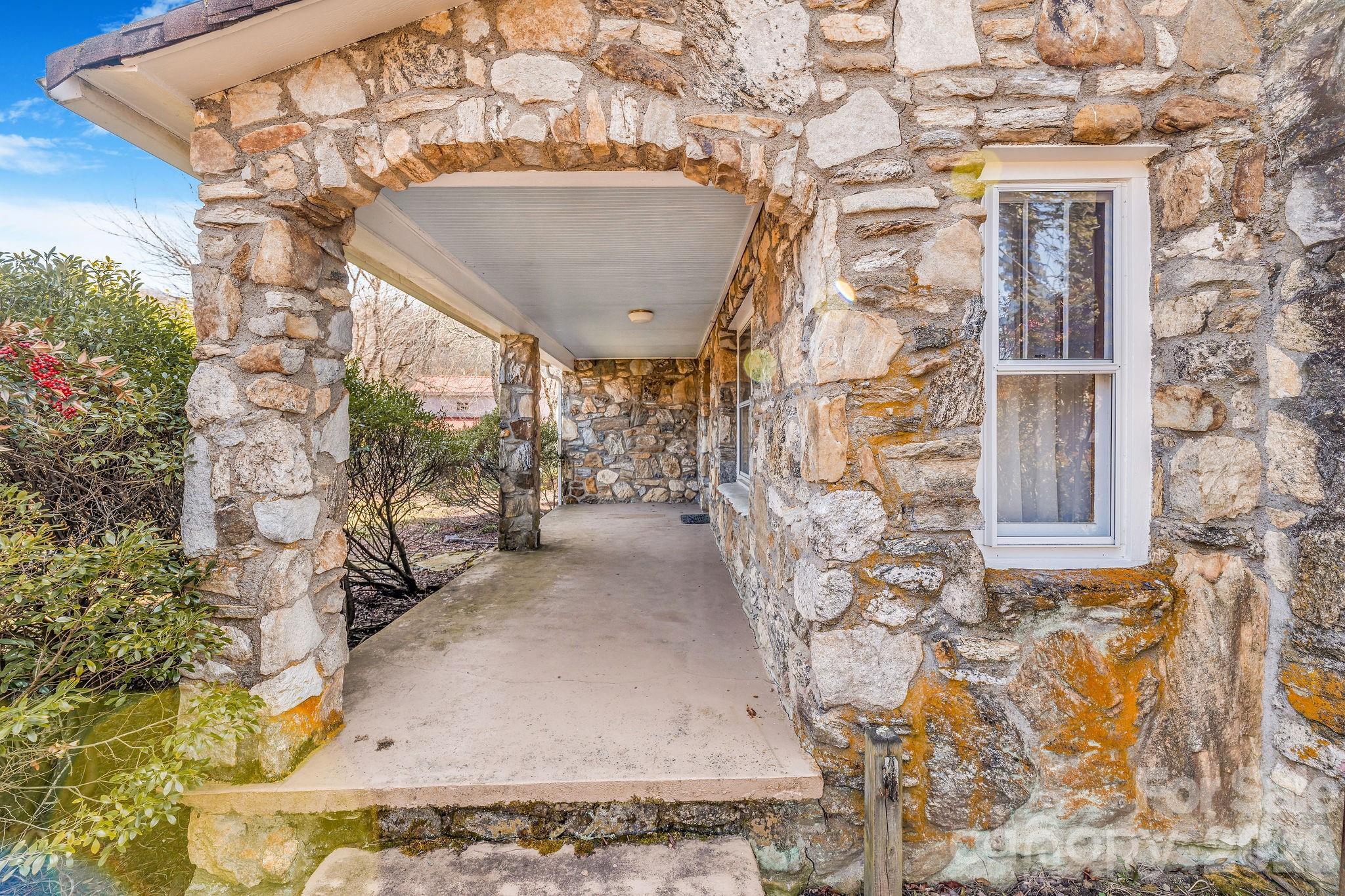 22 Mountain Spring Lane Canton, NC 28716 - Photo 43 of 48 a view of a pathway with a building in the background