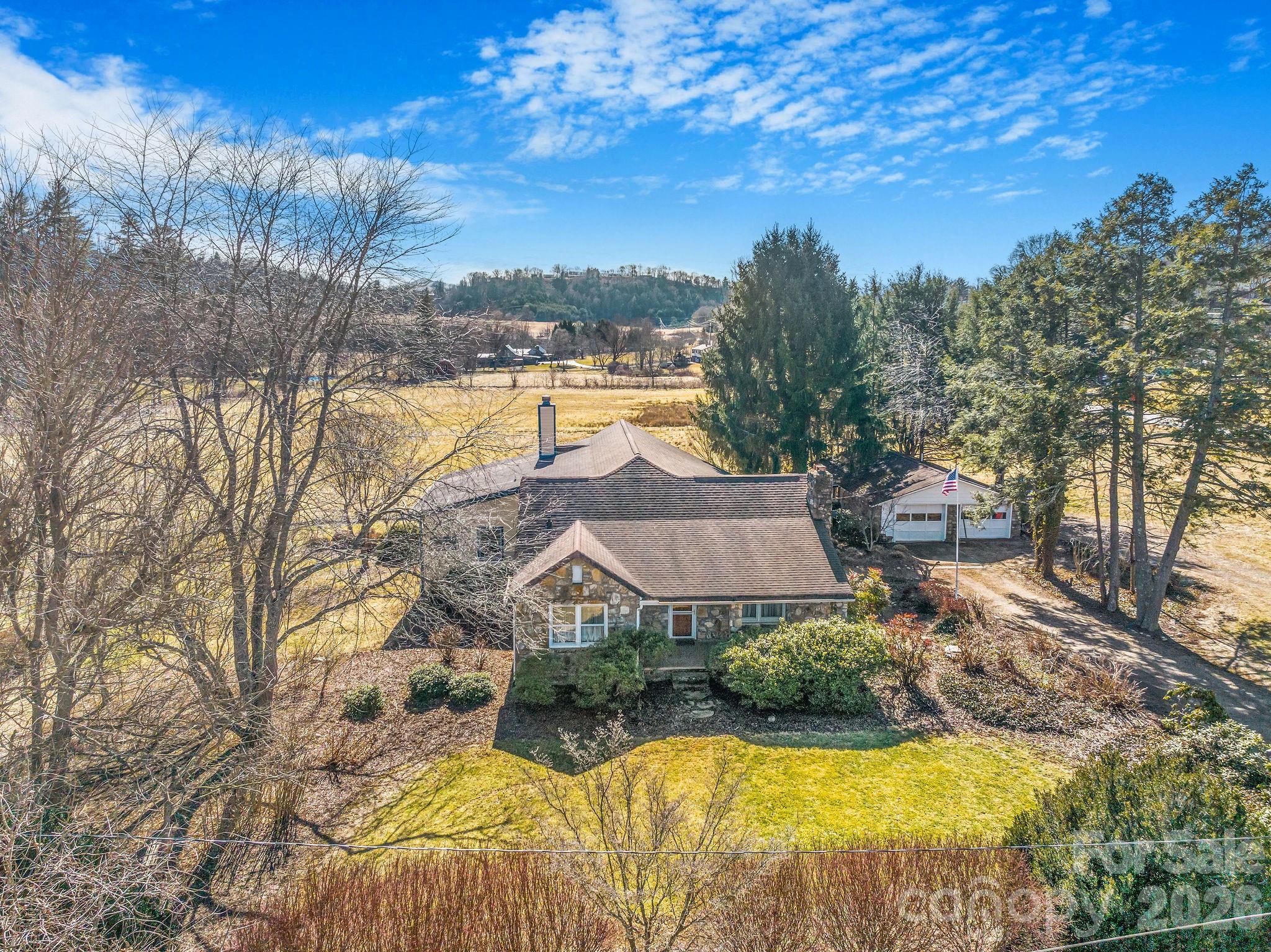 22 Mountain Spring Lane Canton, NC 28716 - Photo 45 of 48 a view of a house with swimming pool and sitting area