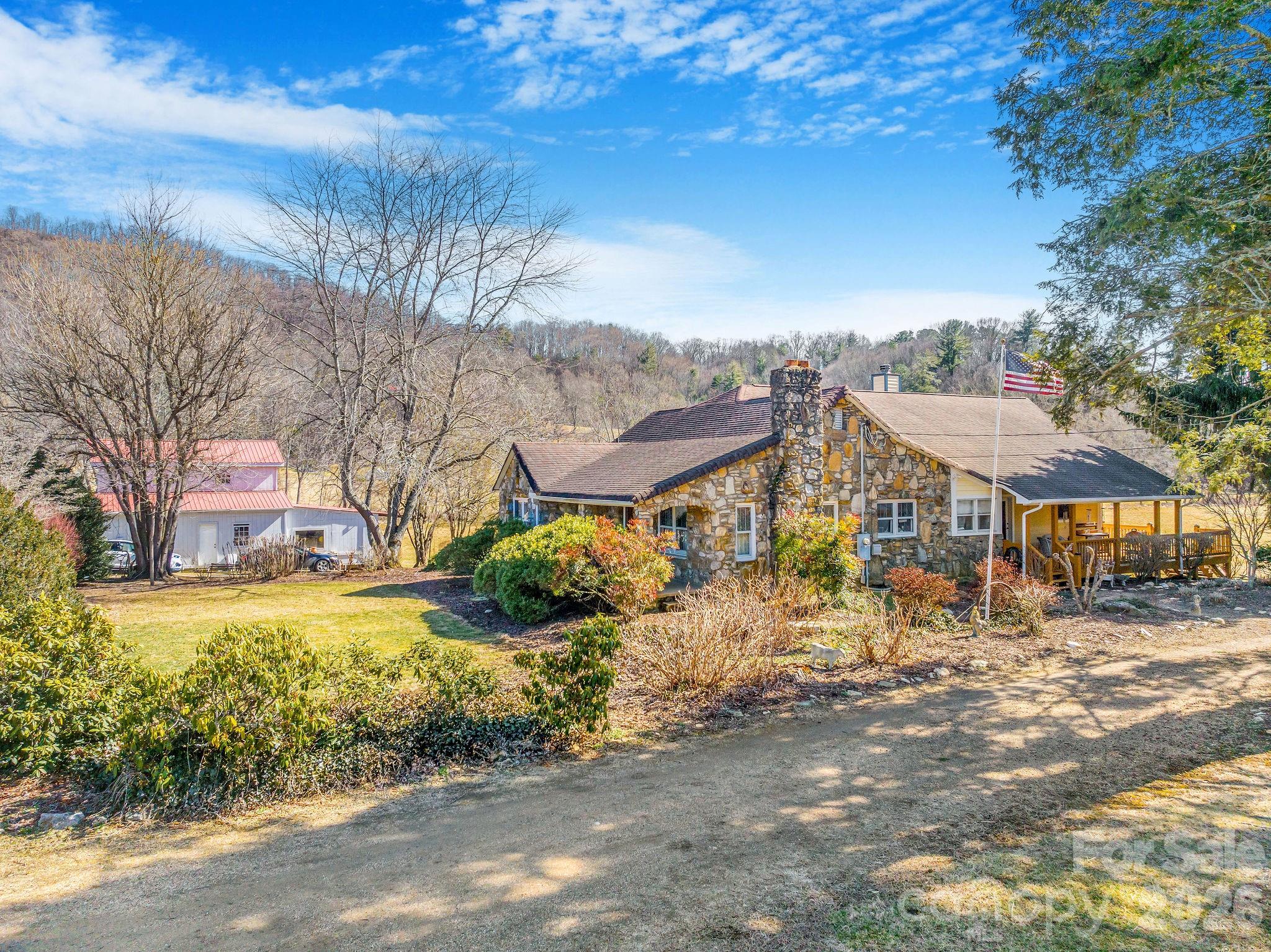 22 Mountain Spring Lane Canton, NC 28716 - Photo 6 of 48 a view of a town with barn house