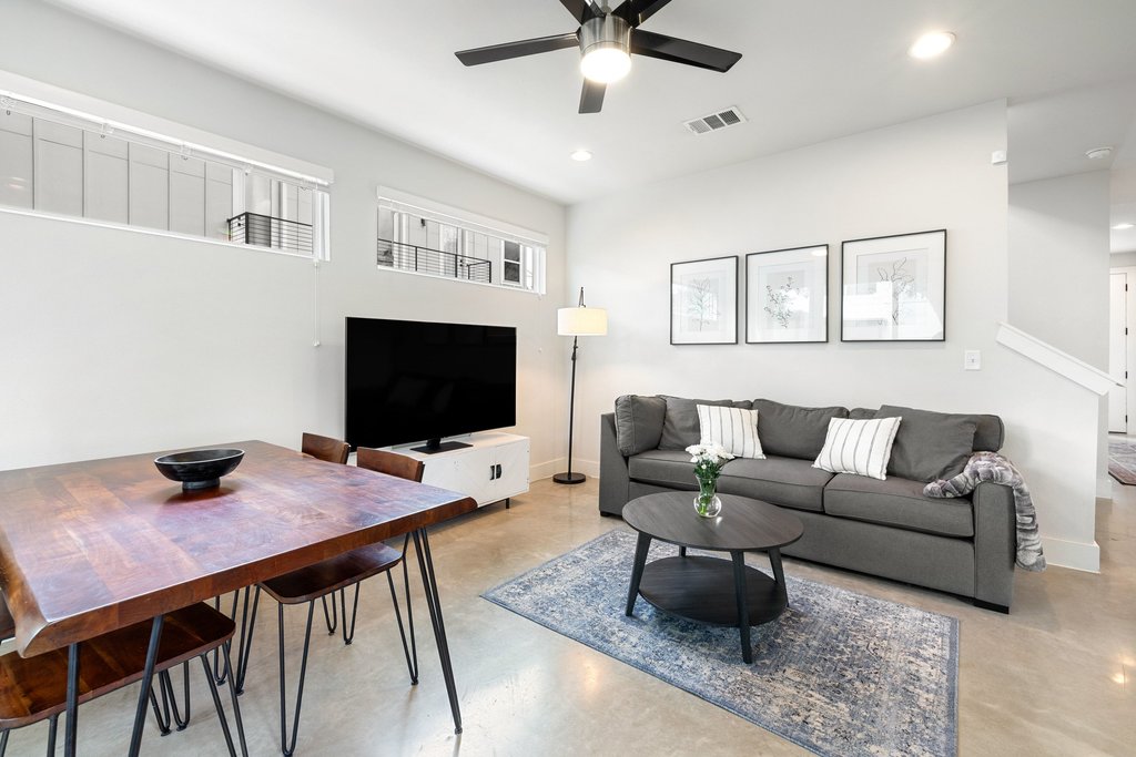 1182 Ridgeway Drive, Unit A Austin, TX 78702 - Photo 12 of 35 a living room with furniture and a flat screen tv