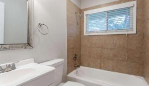 3409 Hyland Drive Decatur, GA 30032 - Photo 13 of 18 a bathroom with a sink a toilet and shower