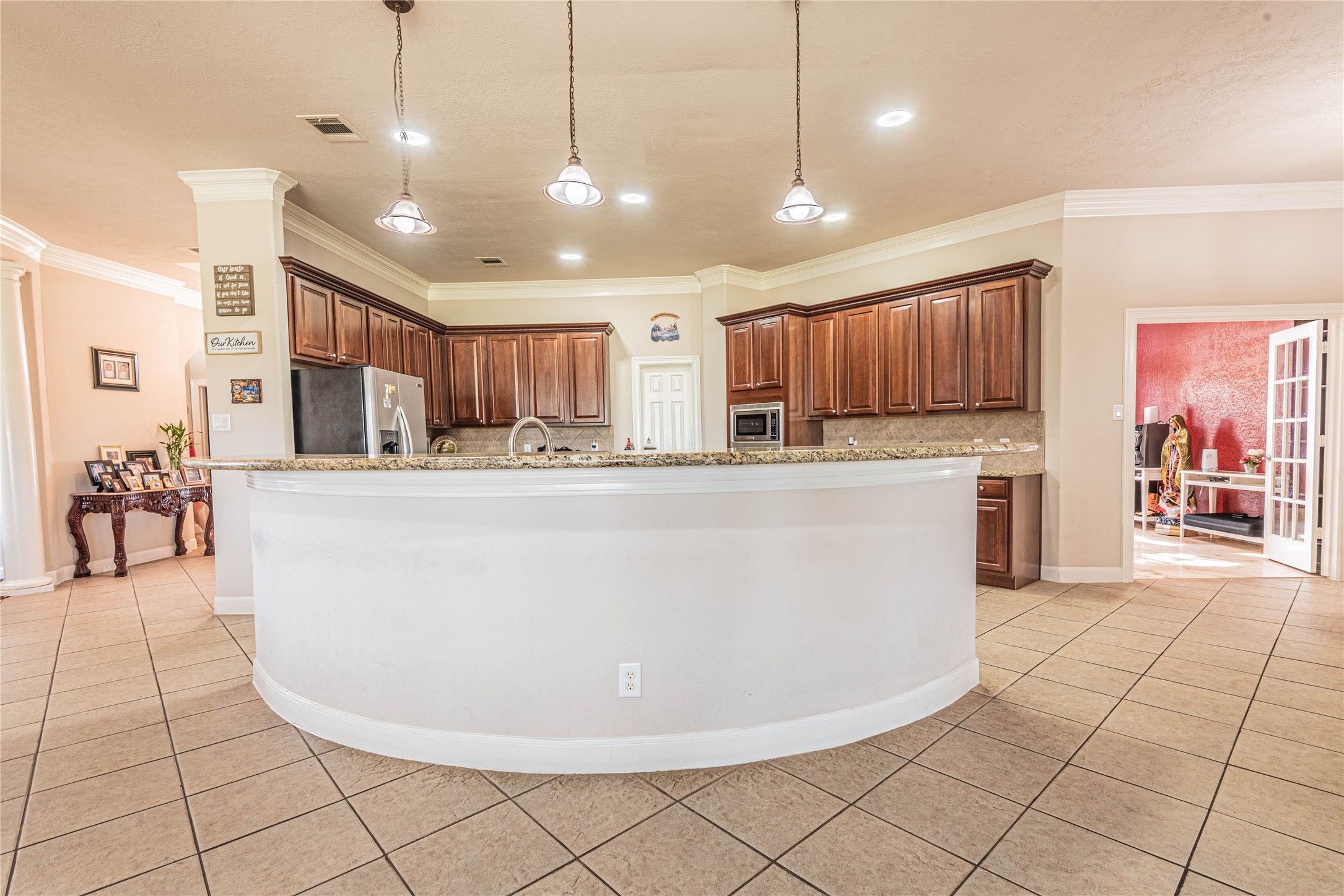 4702 Oasis Point Katy, TX 77493 - Photo 12 of 43 a dining hall with stainless steel appliances granite countertop a stove a sink a oven with a dining table and chairs