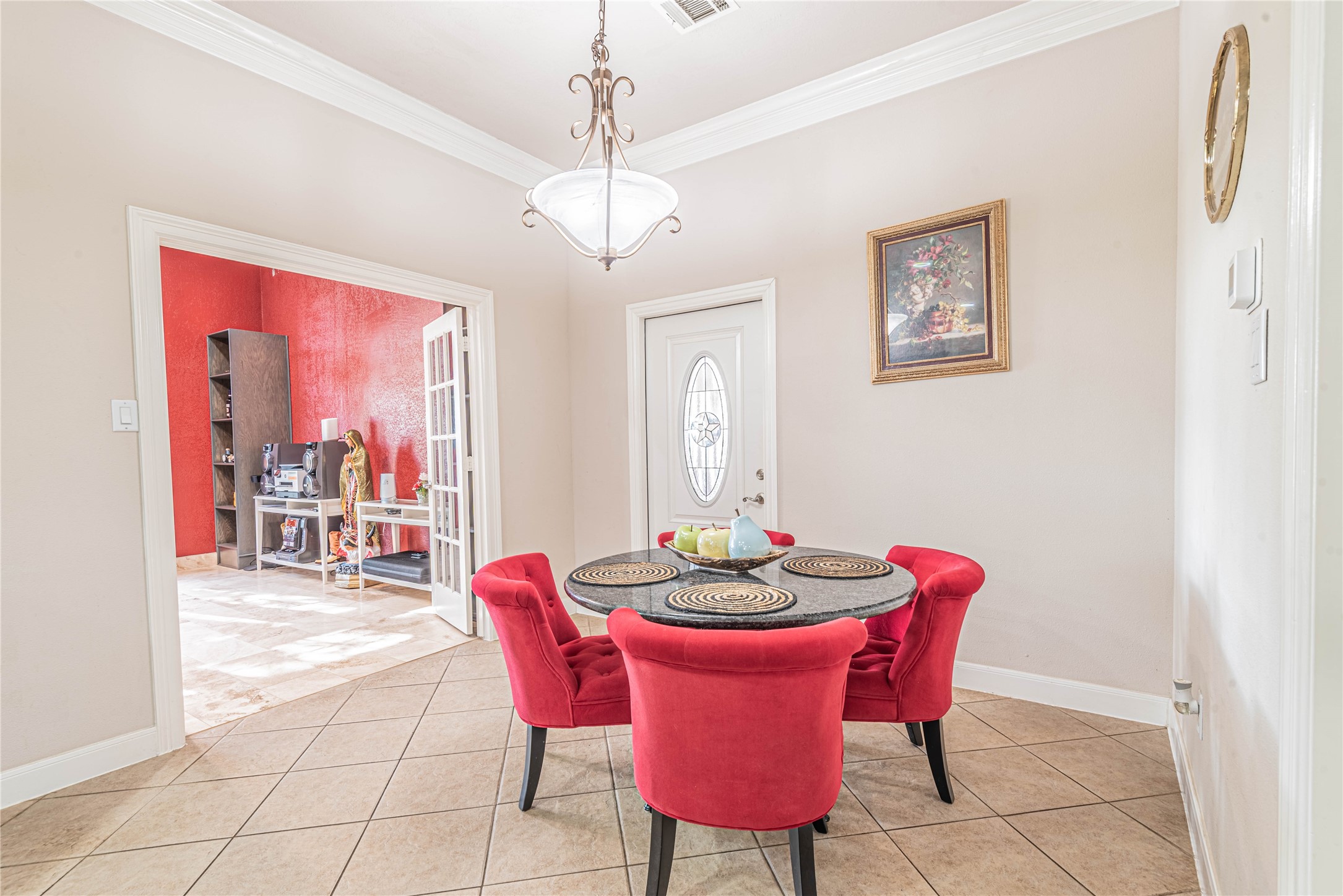 4702 Oasis Point Katy, TX 77493 - Photo 14 of 43 a dining room with furniture a chandelier and window