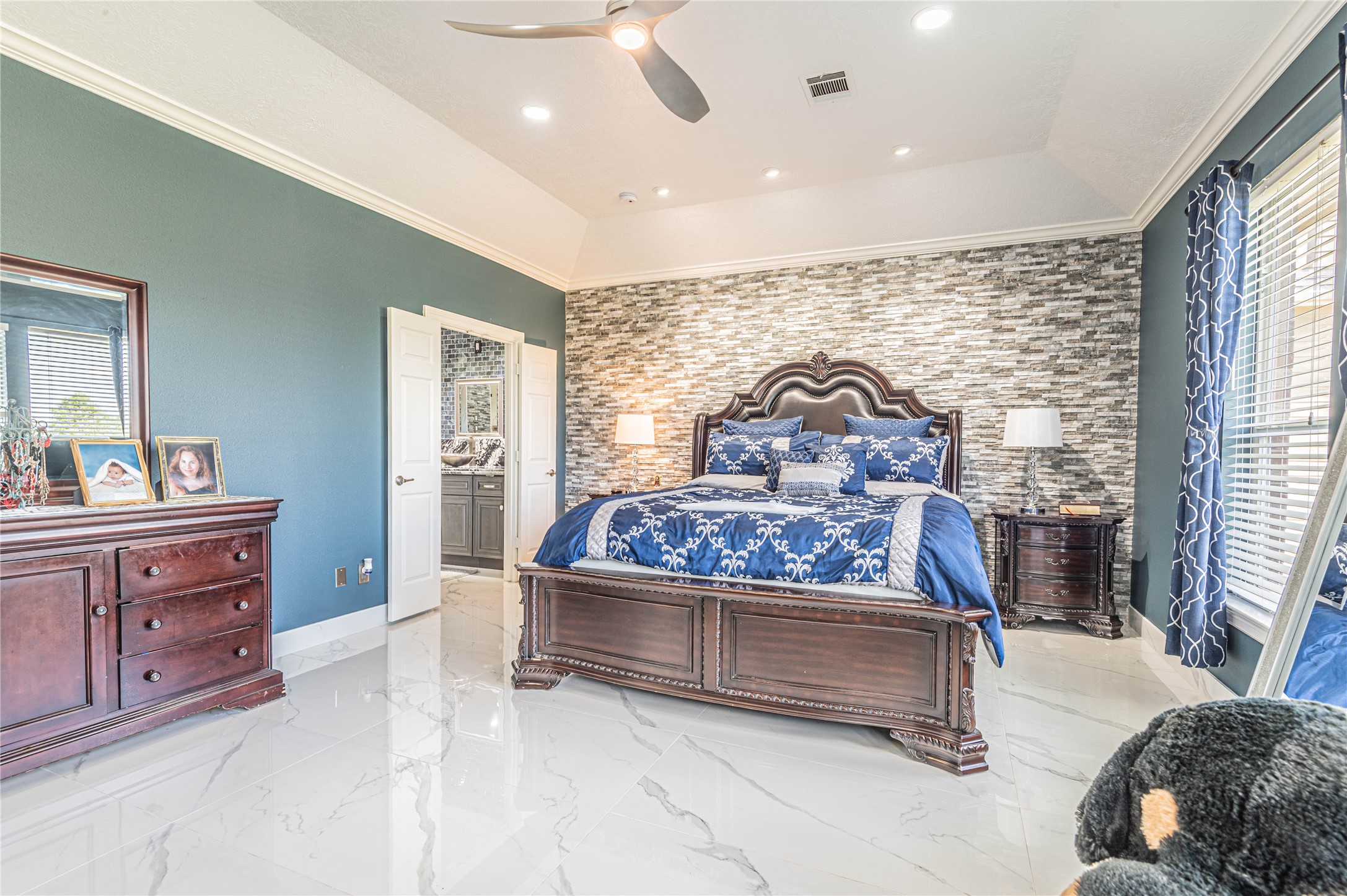 4702 Oasis Point Katy, TX 77493 - Photo 17 of 43 a bedroom with a bed and large windows