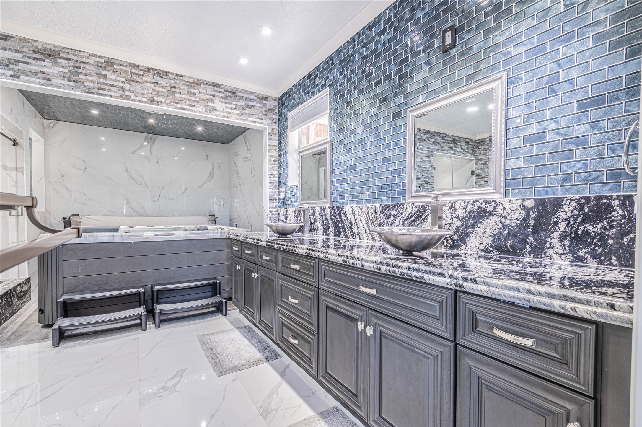 4702 Oasis Point Katy, TX 77493 - Photo 18 of 43 a bathroom with a sink and a mirror