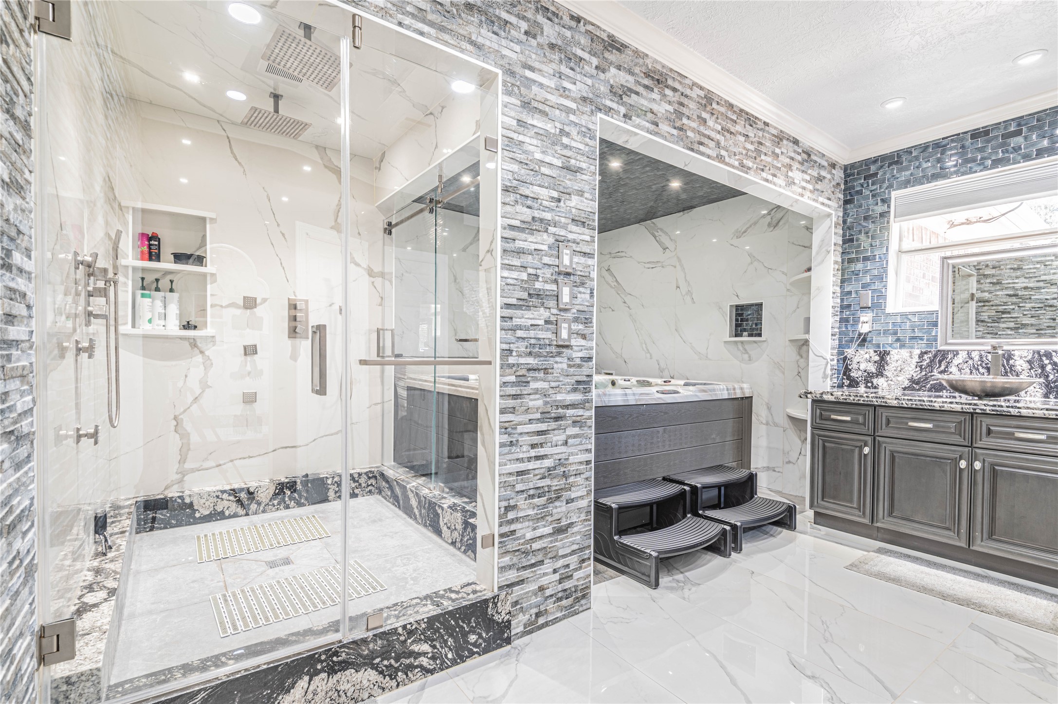 4702 Oasis Point Katy, TX 77493 - Photo 20 of 43 a bathroom with a granite countertop sink mirror bathtub and shower