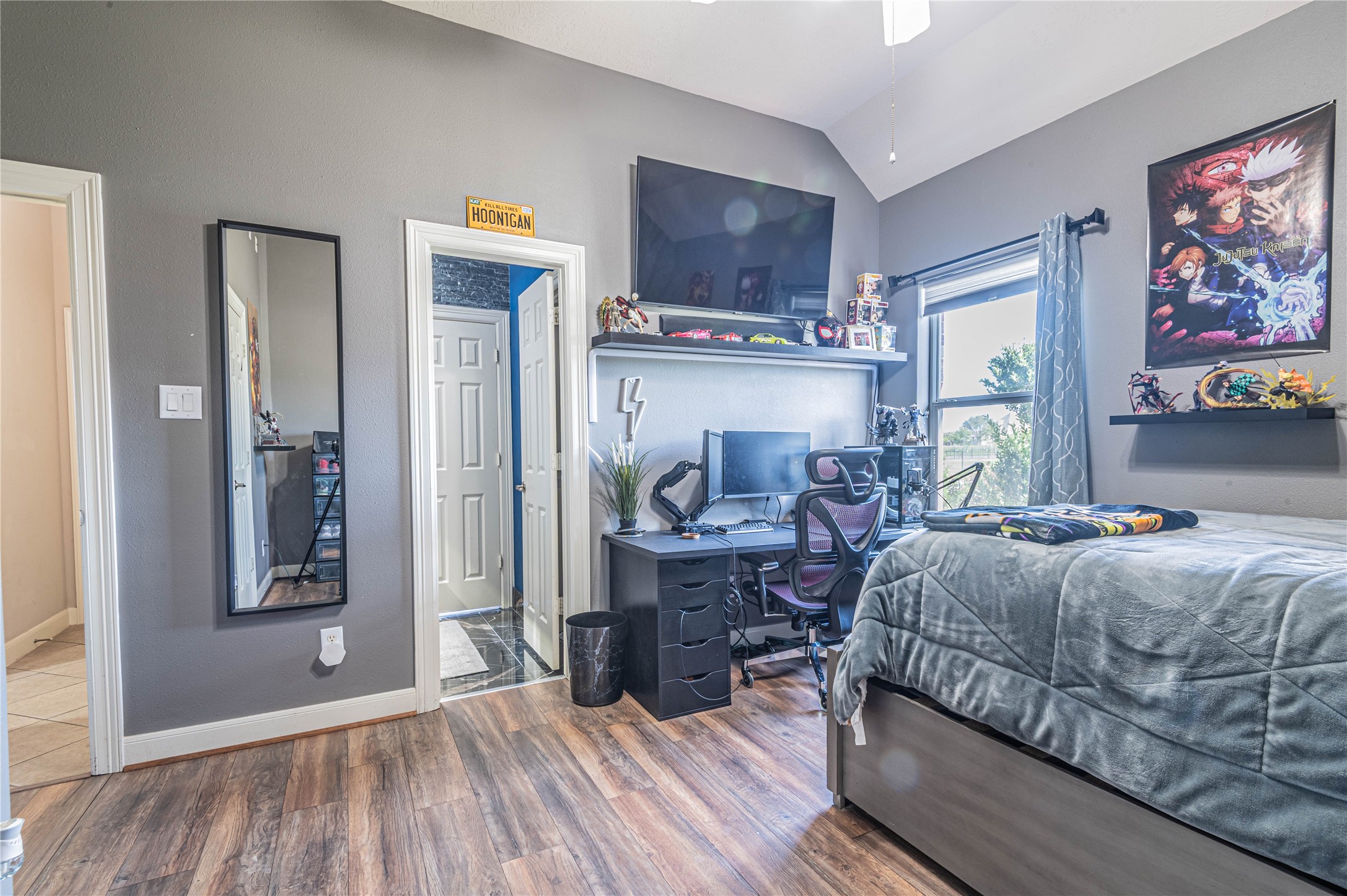 4702 Oasis Point Katy, TX 77493 - Photo 23 of 43 a bedroom with a bed and wooden floor