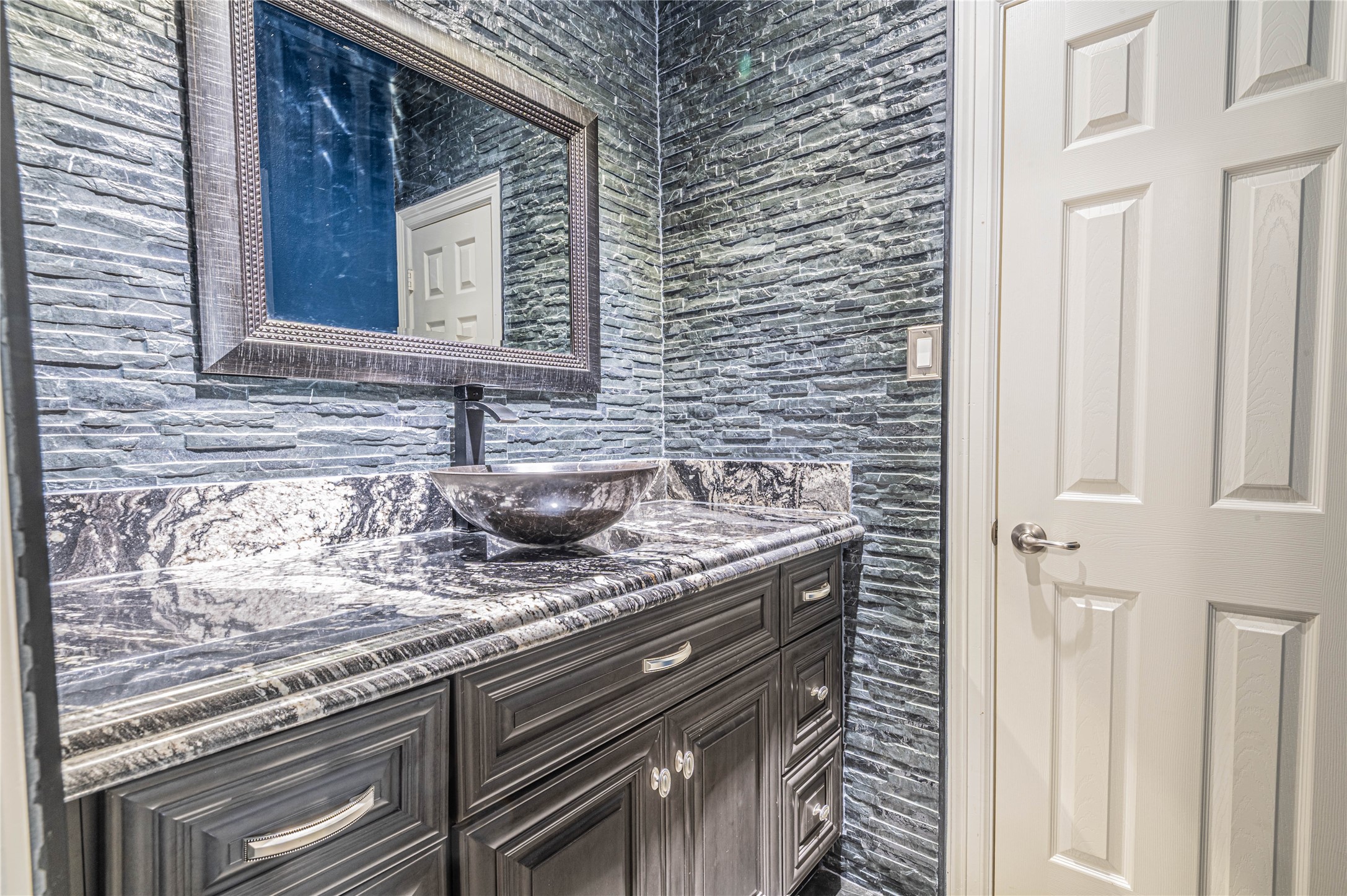 4702 Oasis Point Katy, TX 77493 - Photo 24 of 43 a bathroom with a granite countertop sink and a mirror