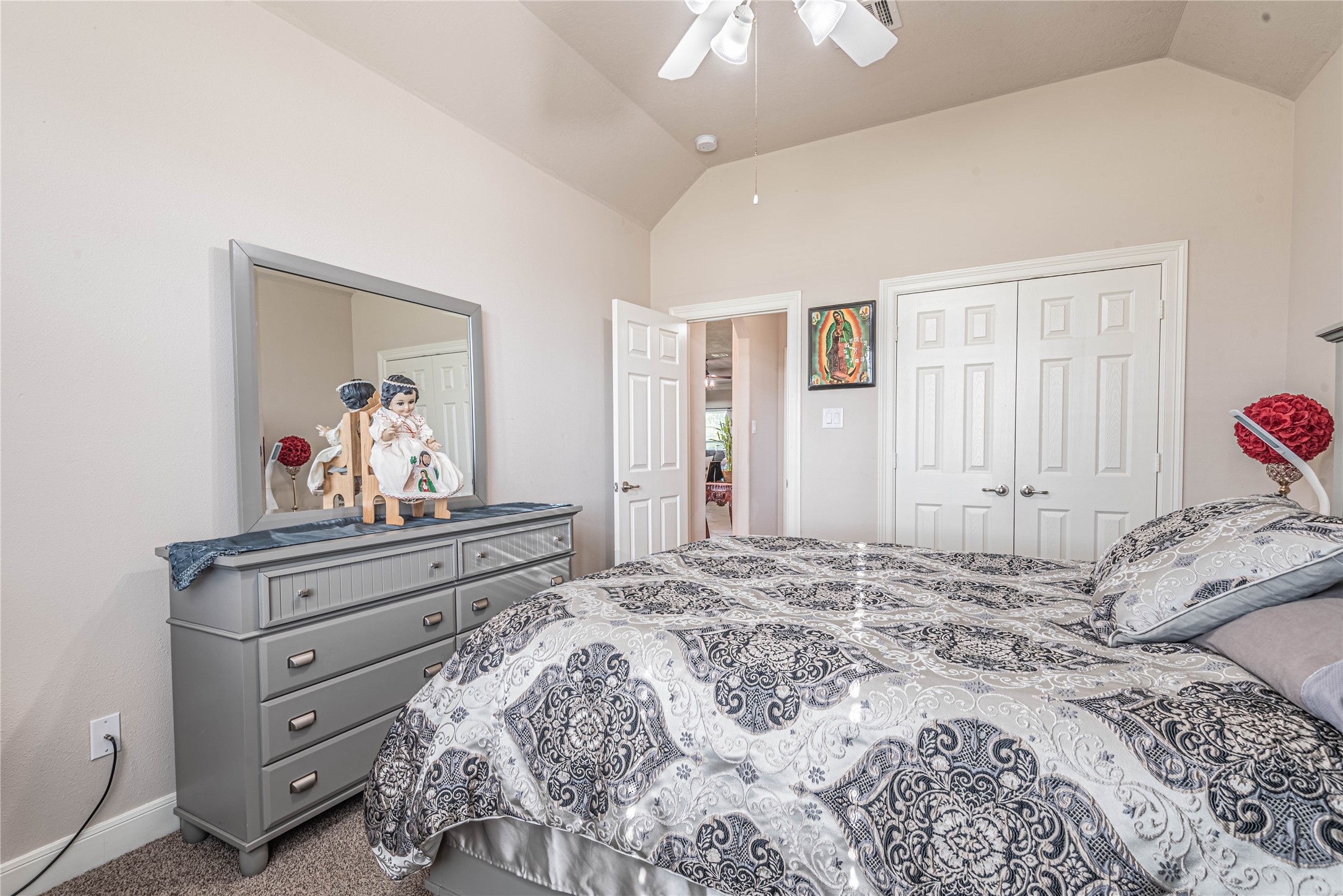 4702 Oasis Point Katy, TX 77493 - Photo 26 of 43 a bedroom with a bed and a dresser