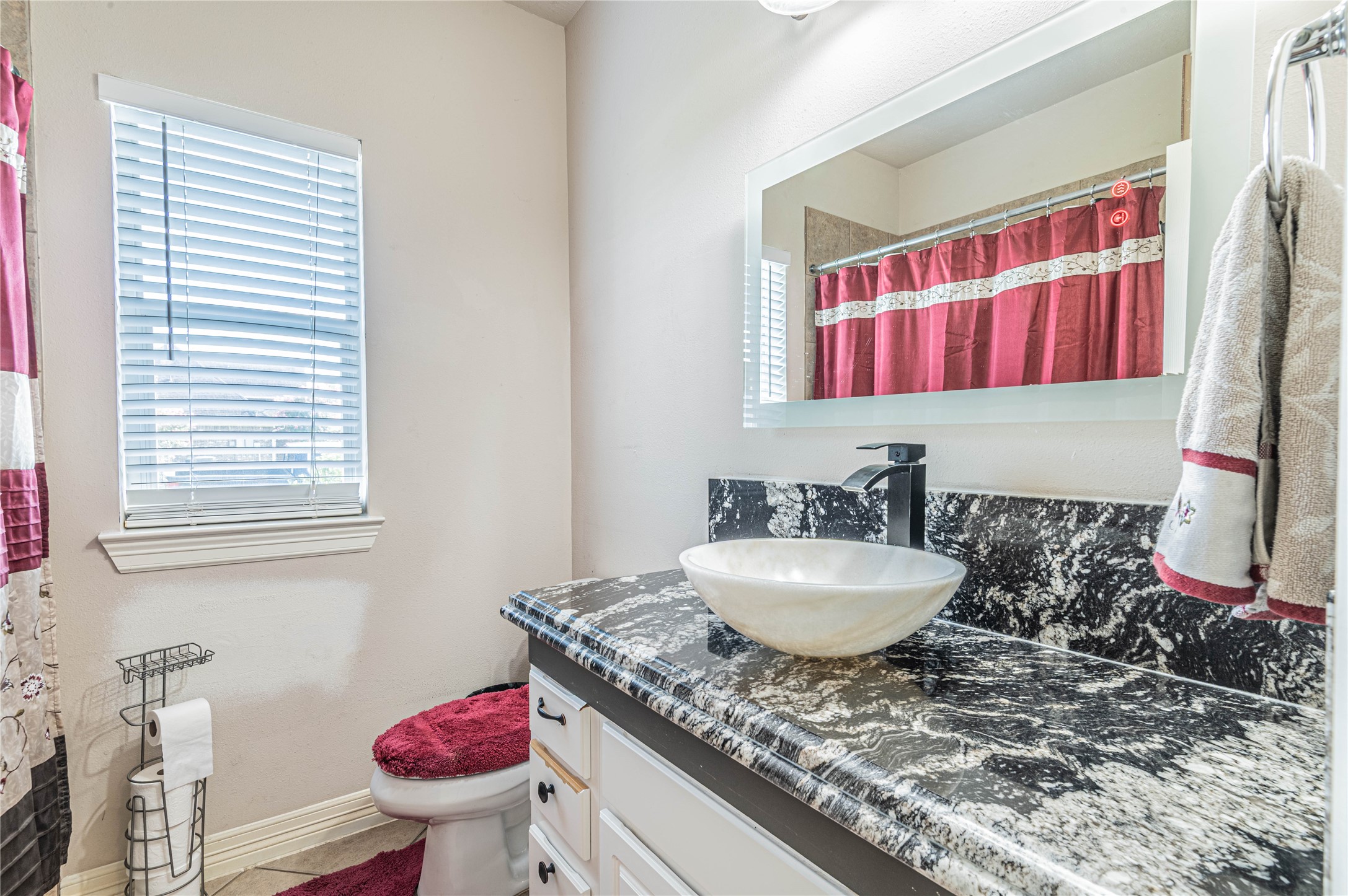 4702 Oasis Point Katy, TX 77493 - Photo 27 of 43 a bathroom with a granite countertop sink and a mirror