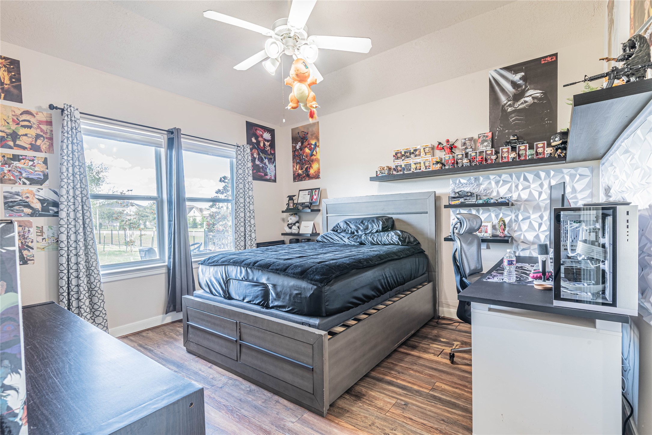4702 Oasis Point Katy, TX 77493 - Photo 28 of 43 a living room with furniture and a chandelier
