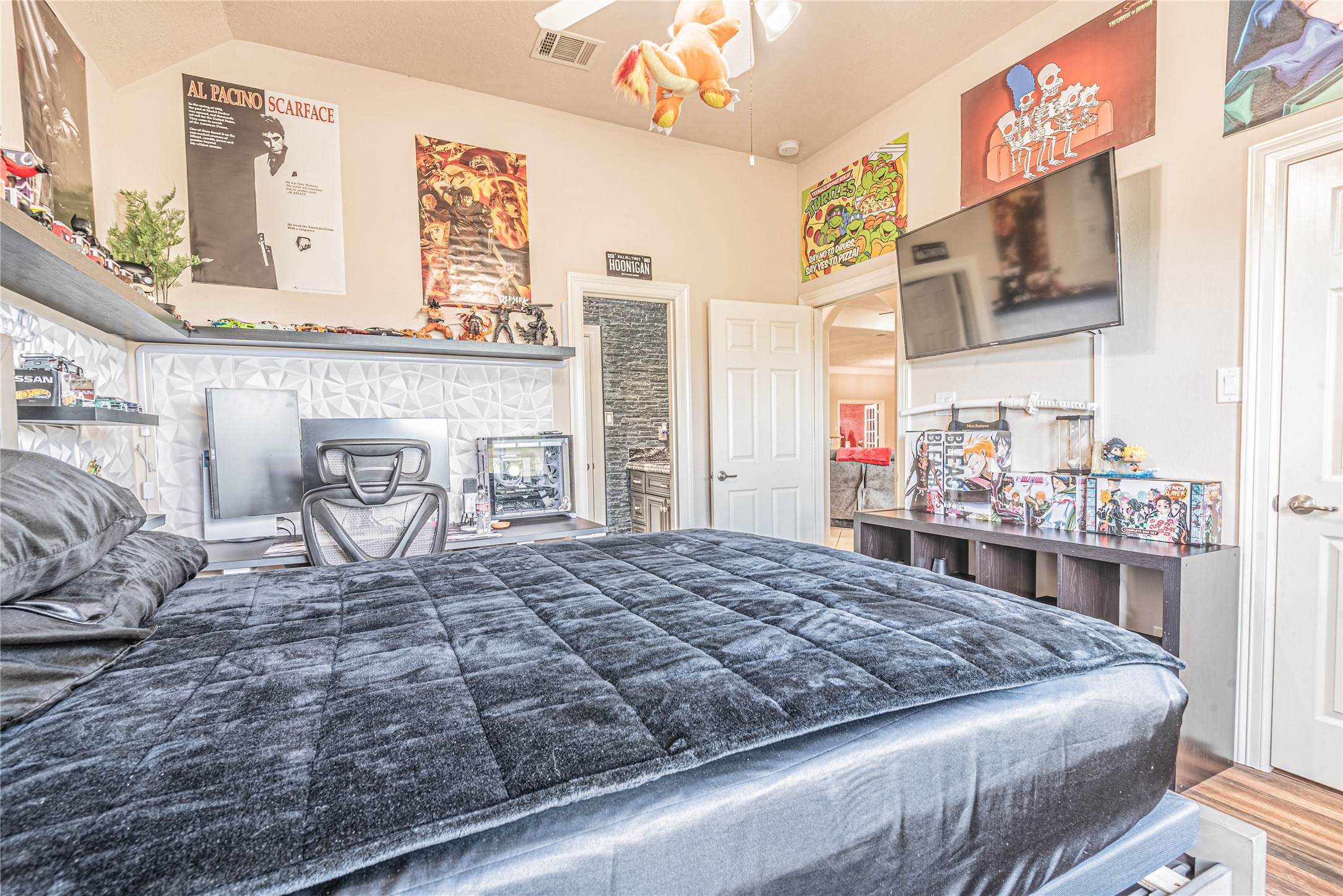 4702 Oasis Point Katy, TX 77493 - Photo 30 of 43 a bed sitting in a bedroom next to a lamp