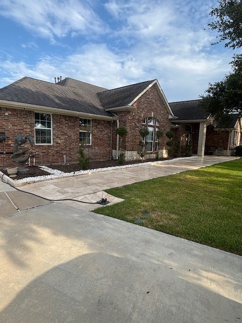 4702 Oasis Point Katy, TX 77493 - Photo 3 of 43 a front view of house with yard and green space