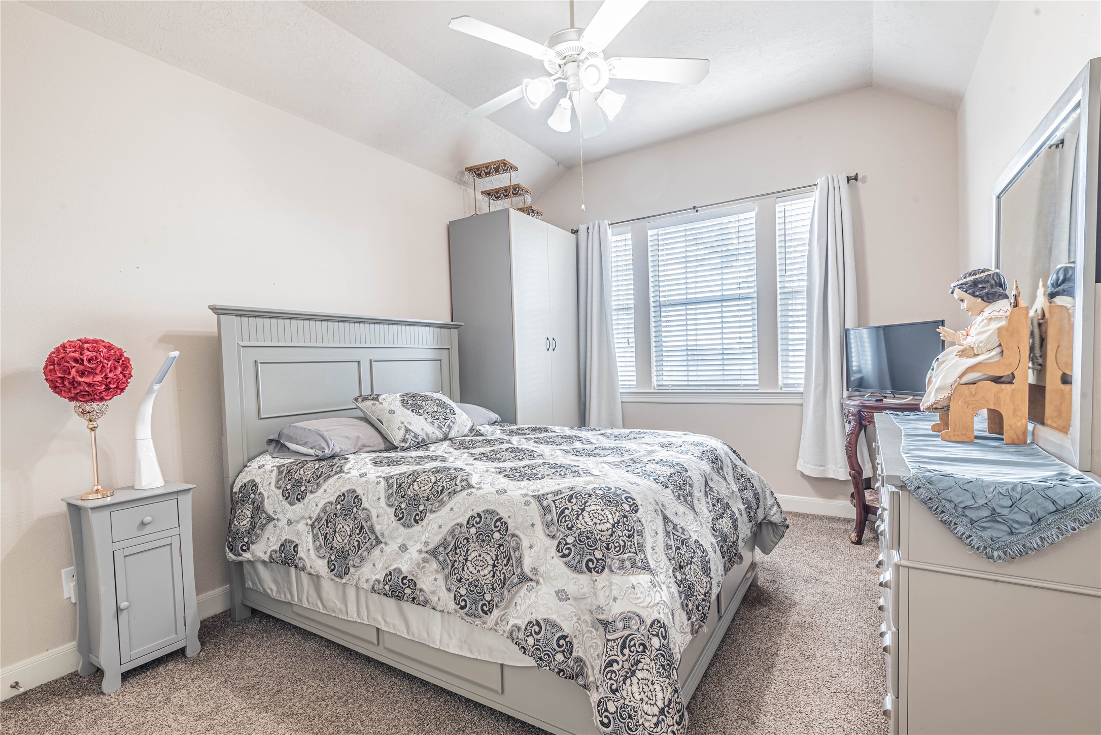 4702 Oasis Point Katy, TX 77493 - Photo 31 of 43 a bedroom with a bed and a dresser