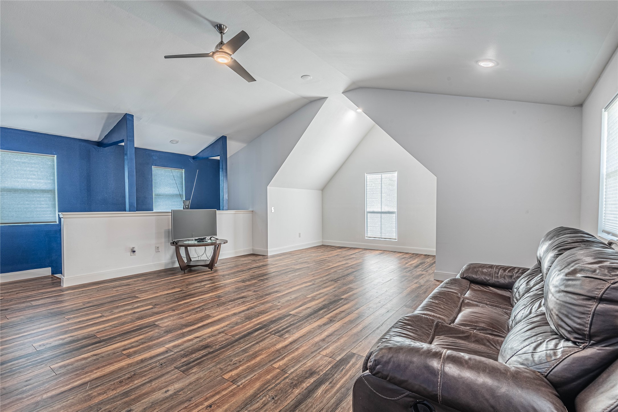 4702 Oasis Point Katy, TX 77493 - Photo 33 of 43 a living room with furniture and a wooden floor