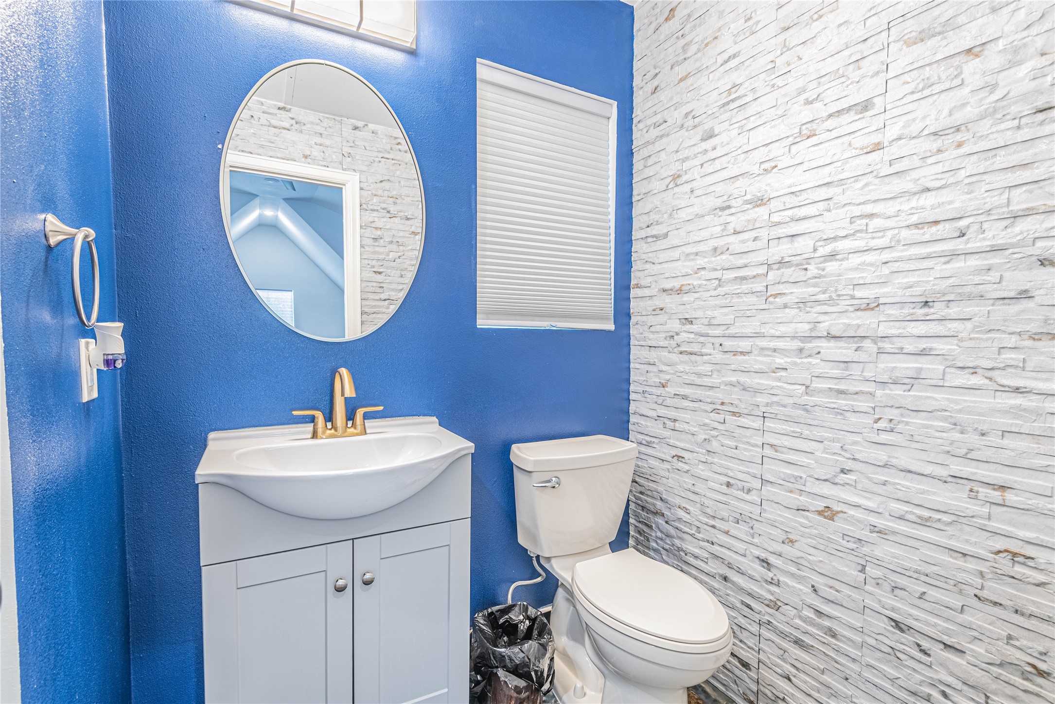 4702 Oasis Point Katy, TX 77493 - Photo 34 of 43 a white toilet sitting next to a bathroom sink