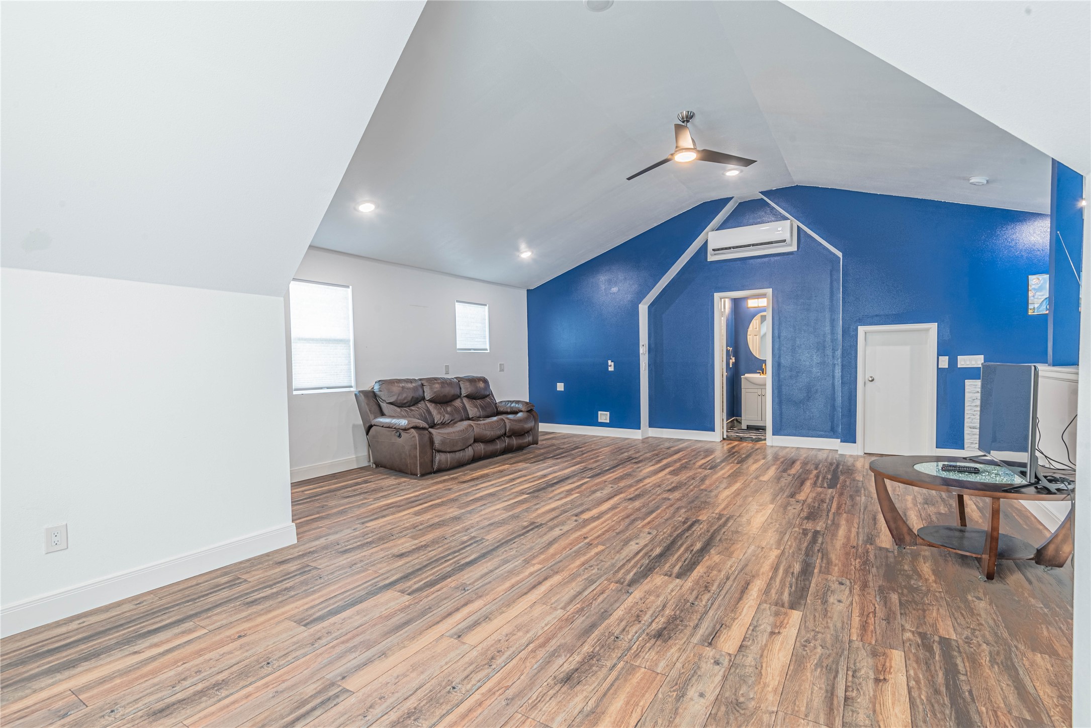 4702 Oasis Point Katy, TX 77493 - Photo 35 of 43 a view of a livingroom with furniture and wooden floor