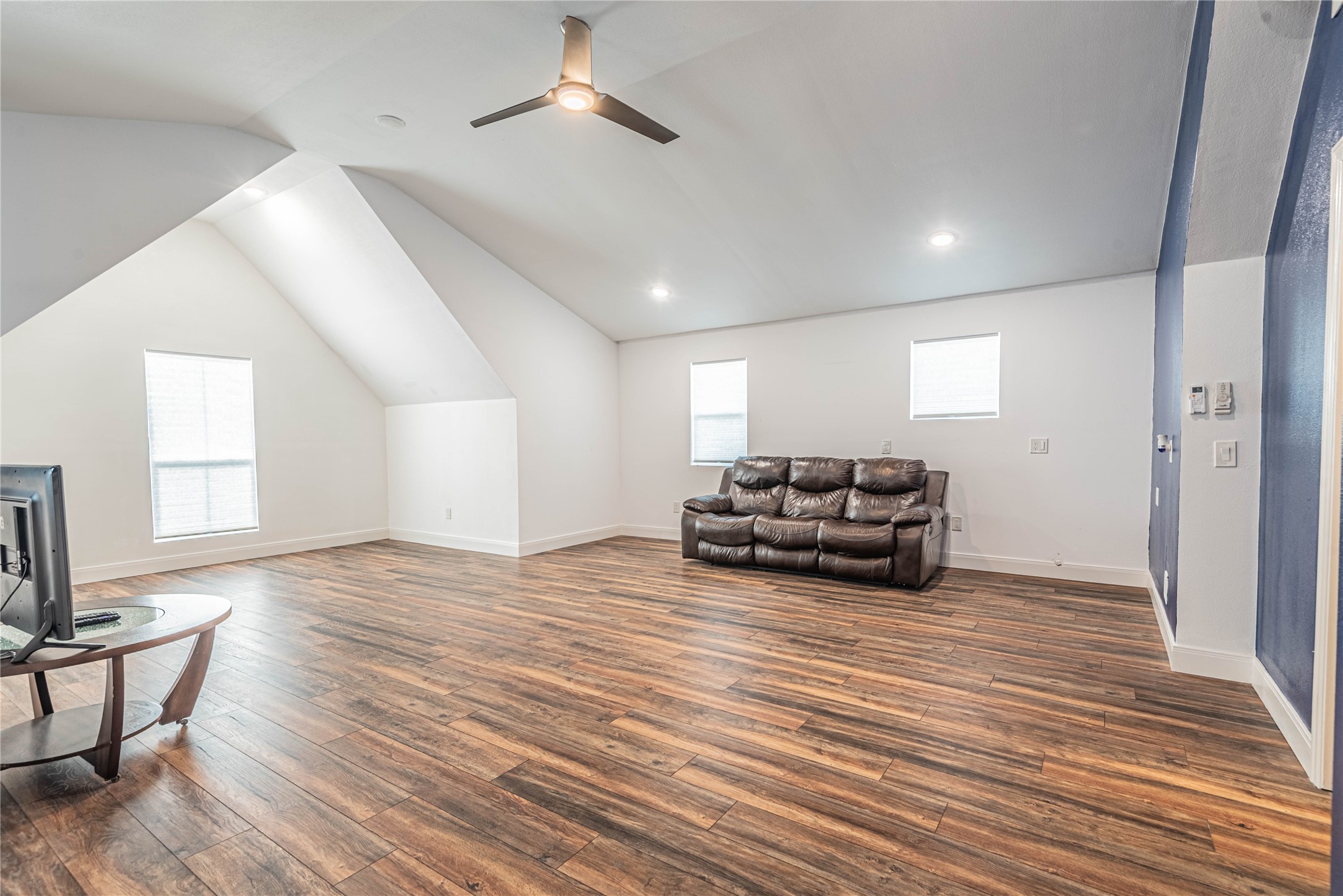 4702 Oasis Point Katy, TX 77493 - Photo 36 of 43 a living room with furniture and a wooden floor