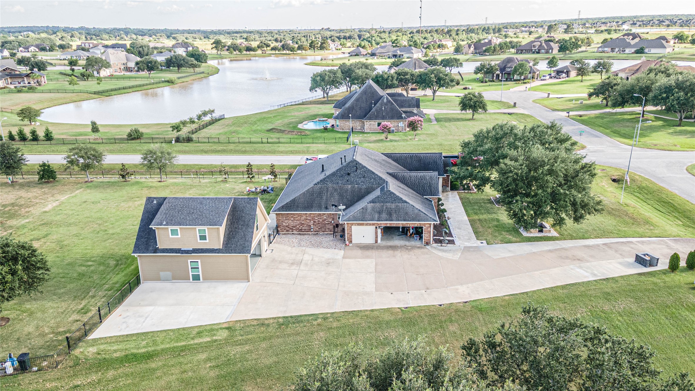 4702 Oasis Point Katy, TX 77493 - Photo 40 of 43 an aerial view of a house with outdoor space and lake view