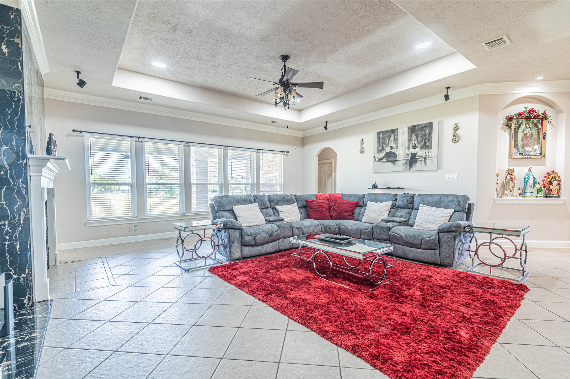4702 Oasis Point Katy, TX 77493 - Photo 8 of 43 a living room with furniture a flat screen tv and a large window
