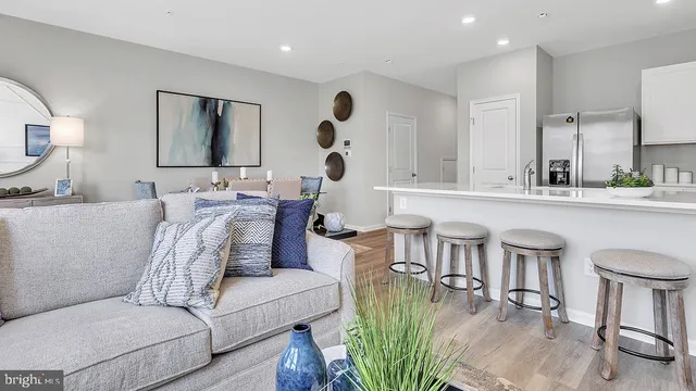 a living room with furniture and a large mirror