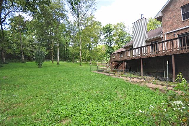 440 Bell Road Watertown, TN 37184 - Photo 14 of 16 a backyard of a house with table and chairs