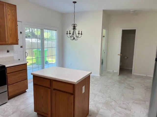 a room that has a window in it and kitchen