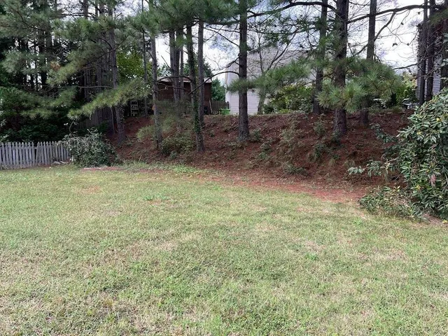a kitchen with a stove a sink and a refrigerator