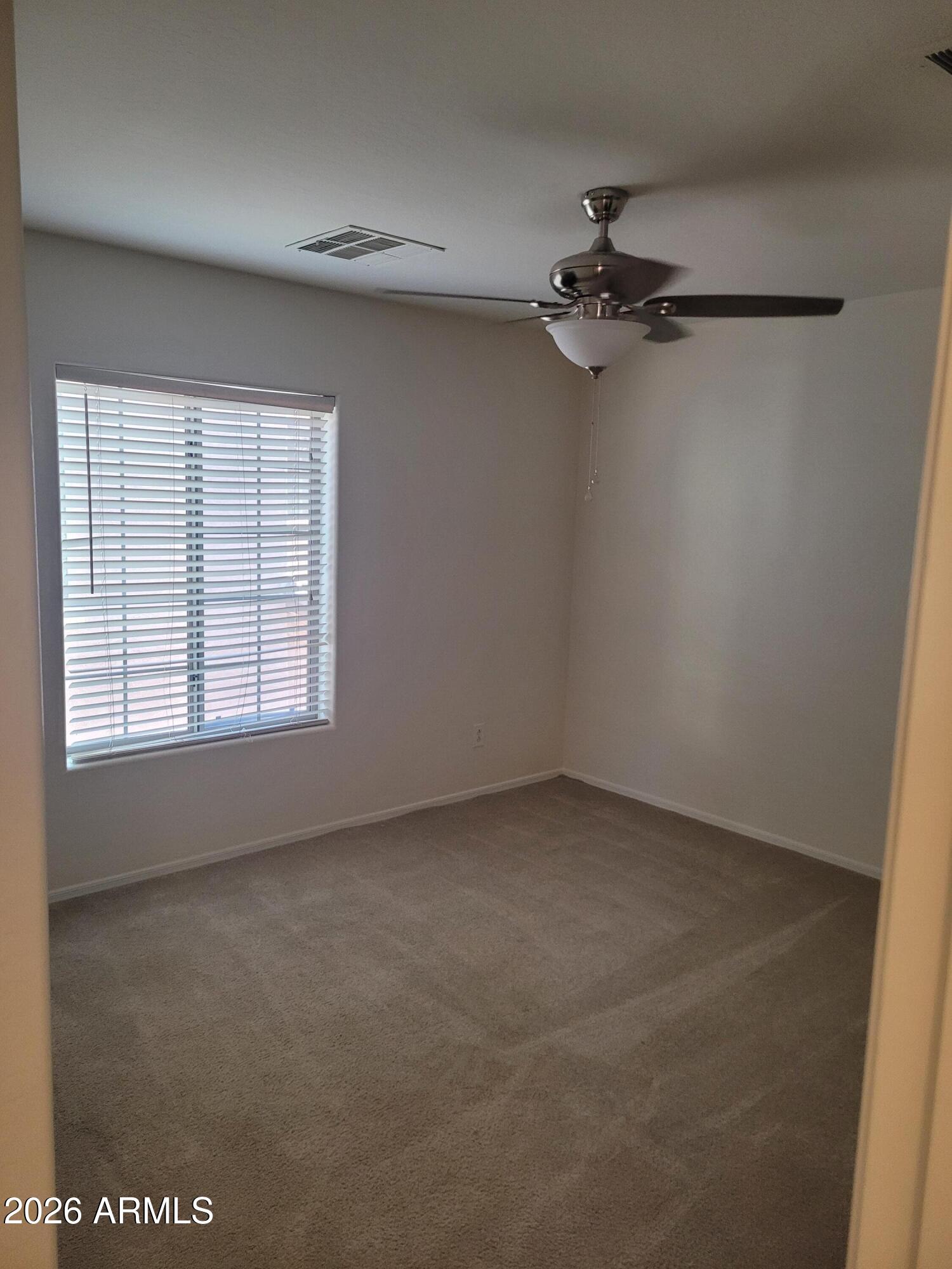 1453 South Sinova Avenue Gilbert, AZ 85296 - Photo 21 of 46 an empty room with a window