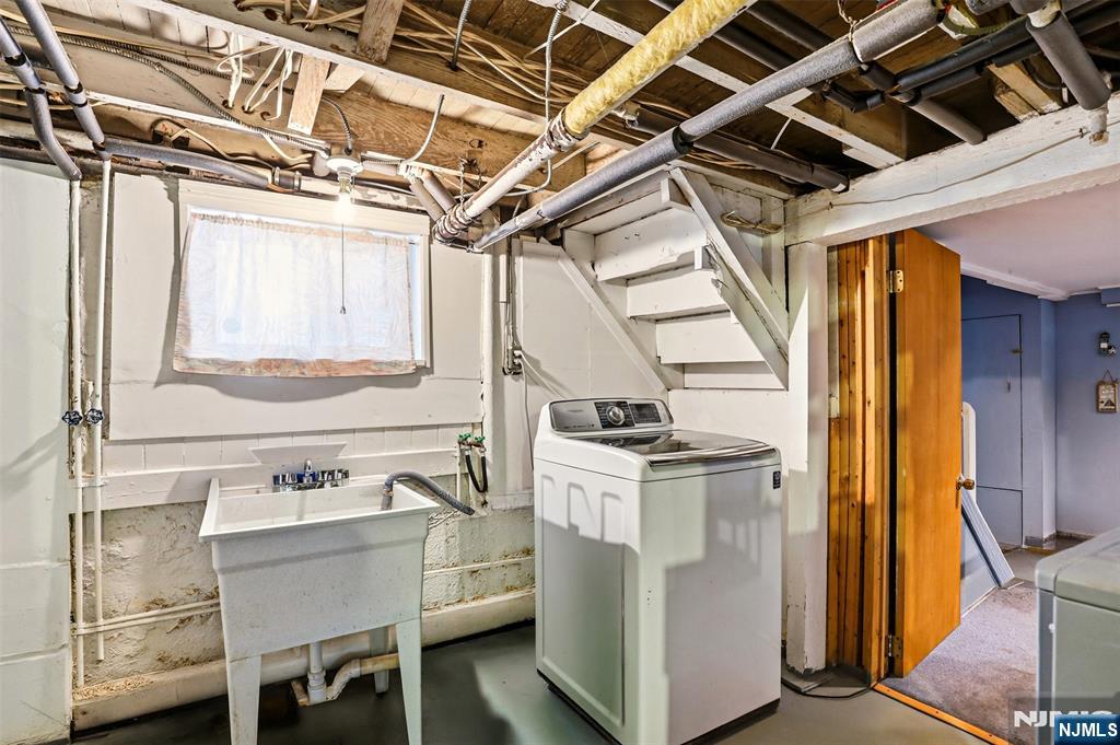 332 Riverside Avenue Lyndhurst, NJ 07071 - Photo 31 of 31 a utility room with dryer and washer