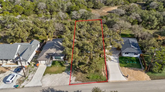 an aerial view of residential house with outdoor space