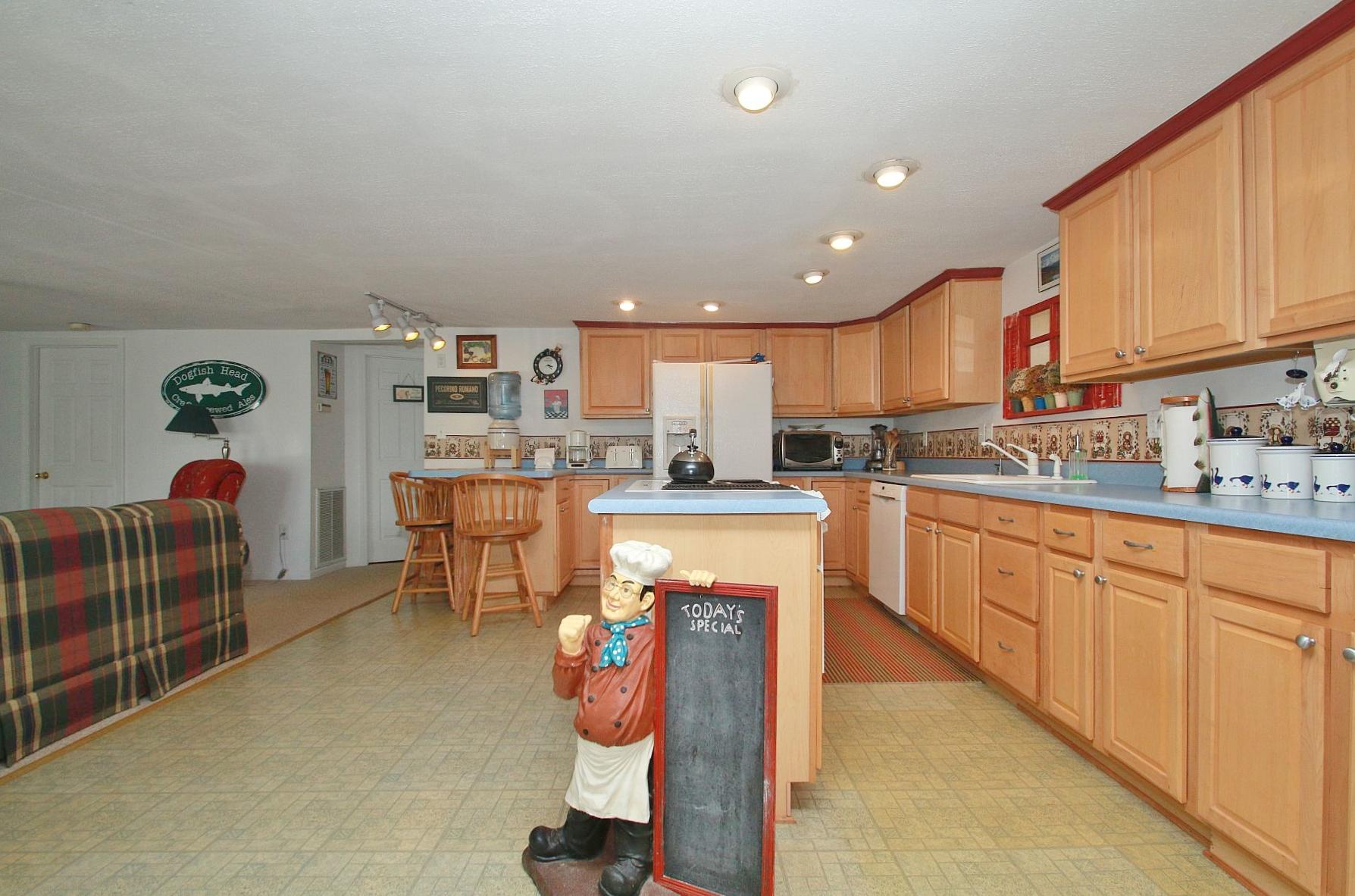 5965 Horseshoe Bend Road Goodview, VA 24095 - Photo 14 of 33 a kitchen with stainless steel appliances kitchen island granite countertop a sink and cabinets
