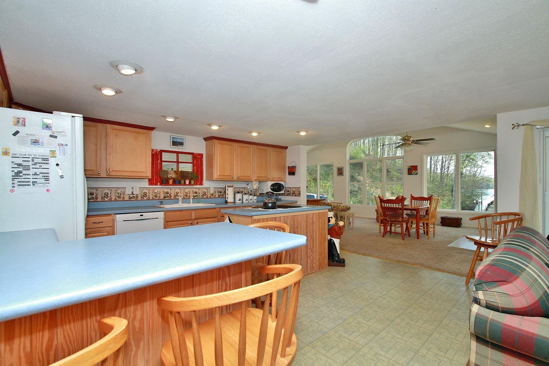 5965 Horseshoe Bend Road Goodview, VA 24095 - Photo 15 of 33 a kitchen with stainless steel appliances lots of counter space and chairs in it
