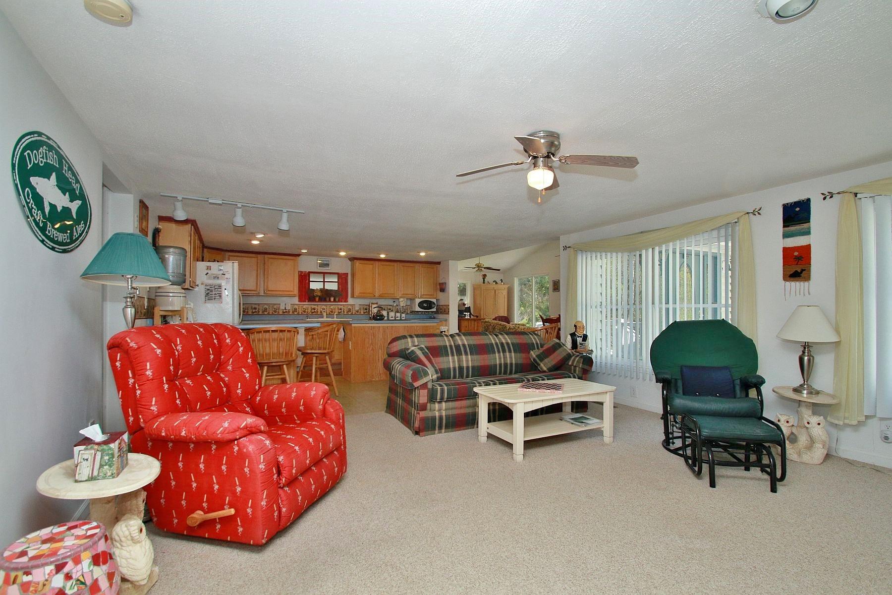 5965 Horseshoe Bend Road Goodview, VA 24095 - Photo 17 of 33 a living room with furniture a rug and white walls
