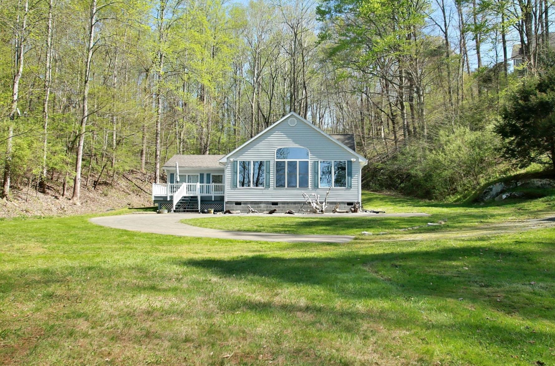 5965 Horseshoe Bend Road Goodview, VA 24095 - Photo 3 of 33 a front view of a house with a garden