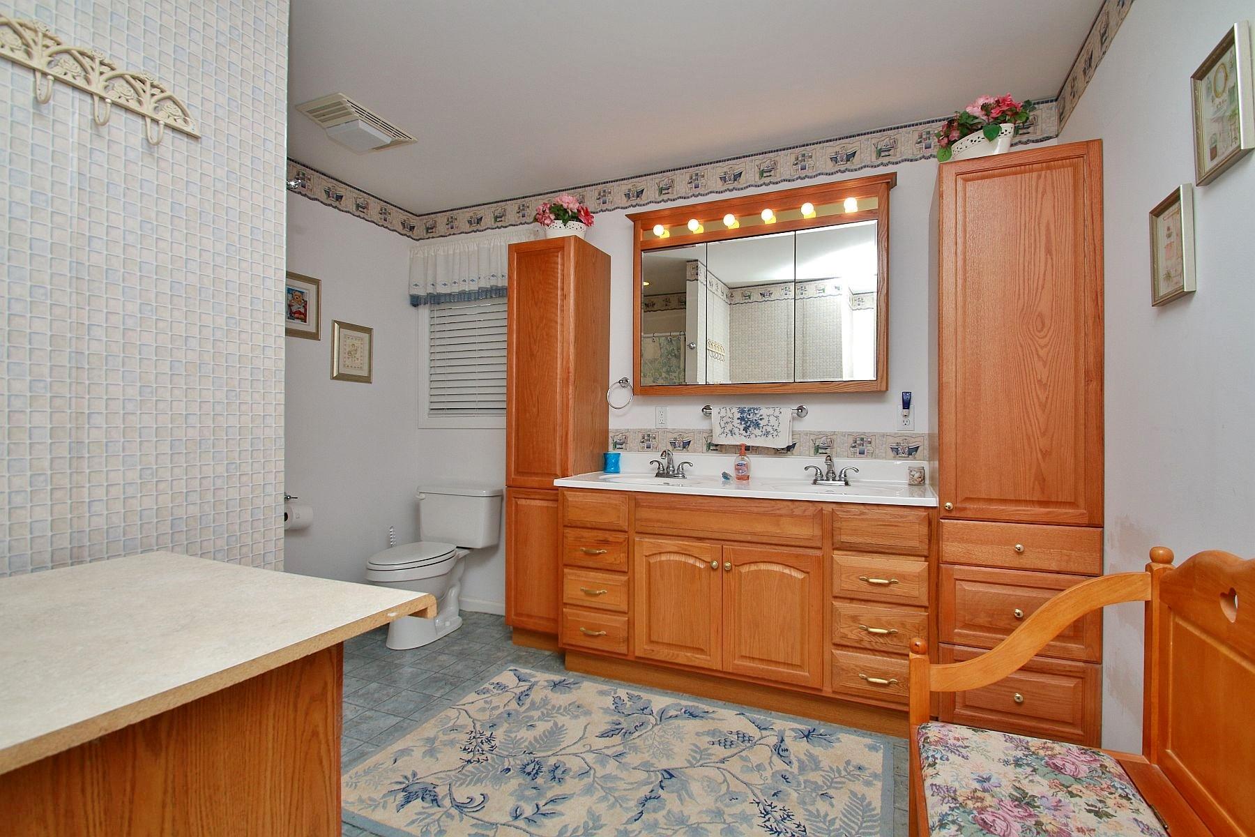 5965 Horseshoe Bend Road Goodview, VA 24095 - Photo 22 of 33 a bathroom with a sink toilet and shower